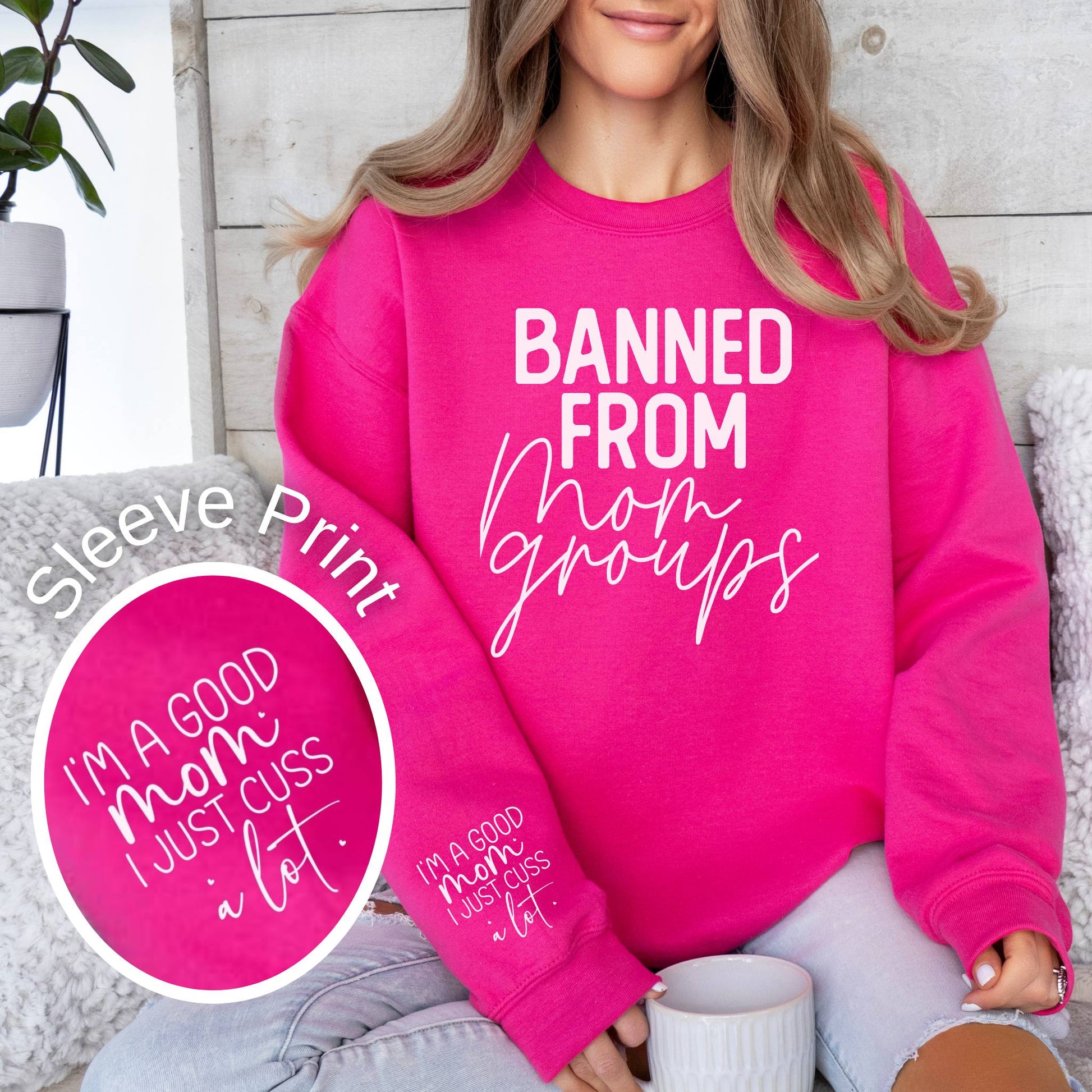 Banned from mom groups funny quote on a pink women's crewneck sweatshirt.