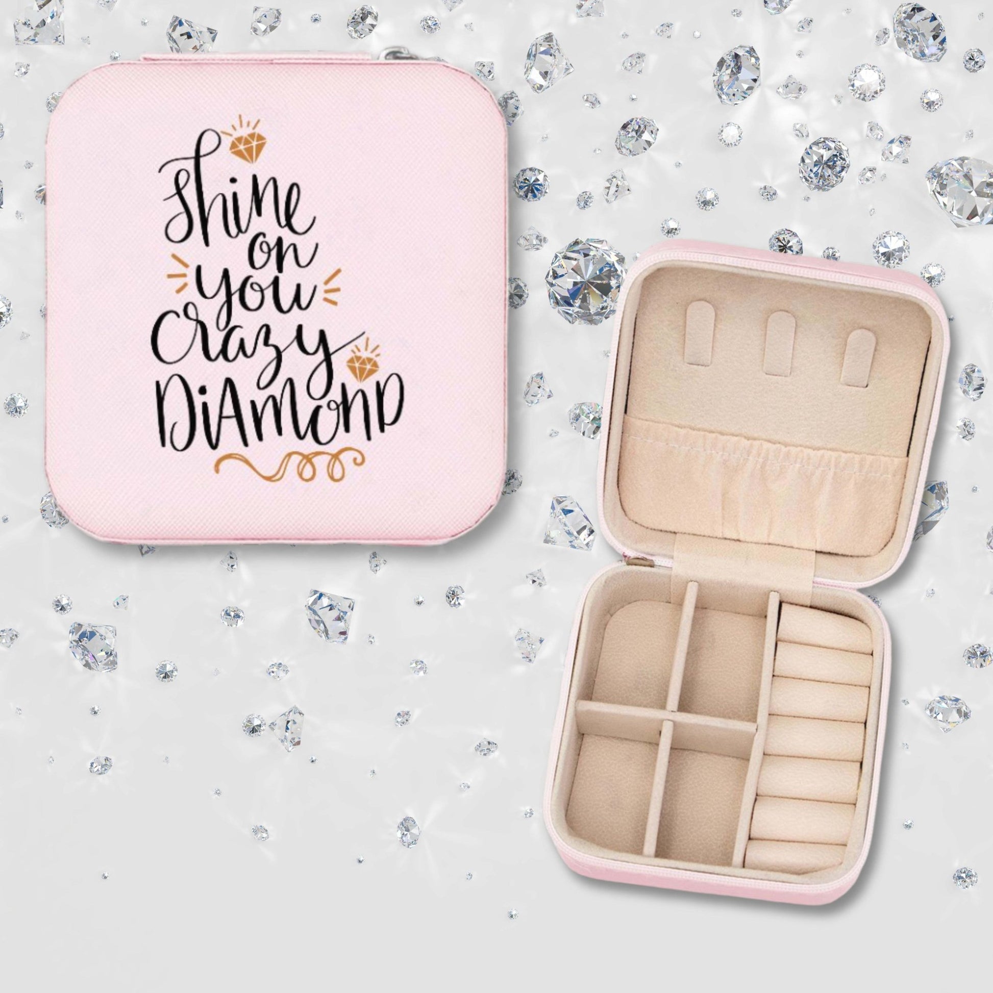 Pink jewelry box for carry on luggage. Shine on you crazy diamond funny quote on the front. Inside is a variety of compartments for necklaces, rings, earrings or bracelets.